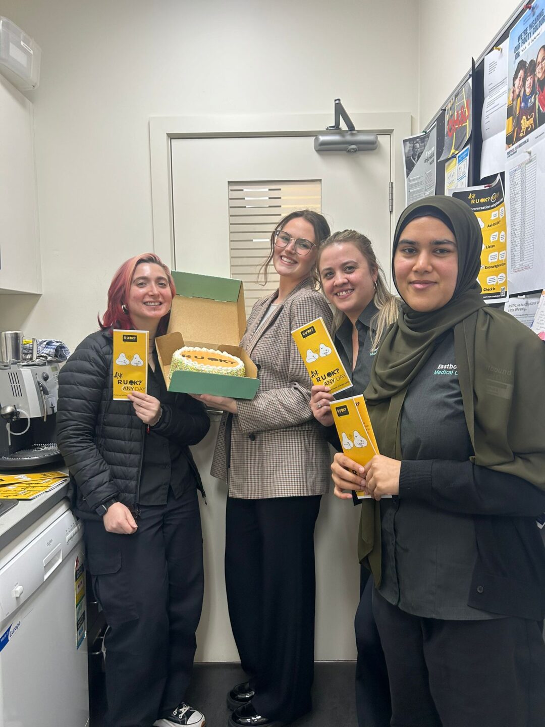 Eastbound staff gathering to have a chat and enjoy a custom-made R U OK cake.